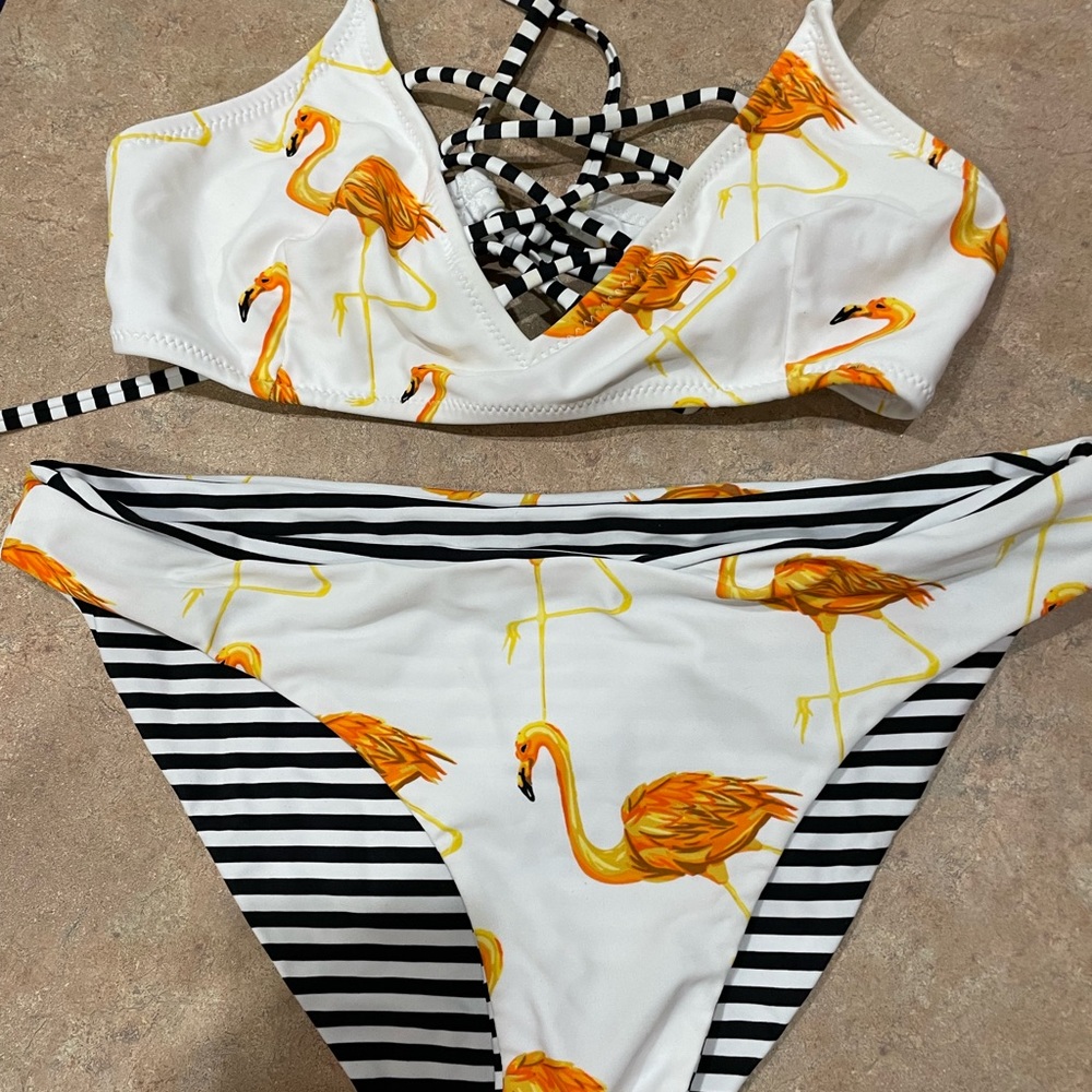 Flamingo LG swimsuit.Crossover in front to make suit sexy.Bottom is reversible.